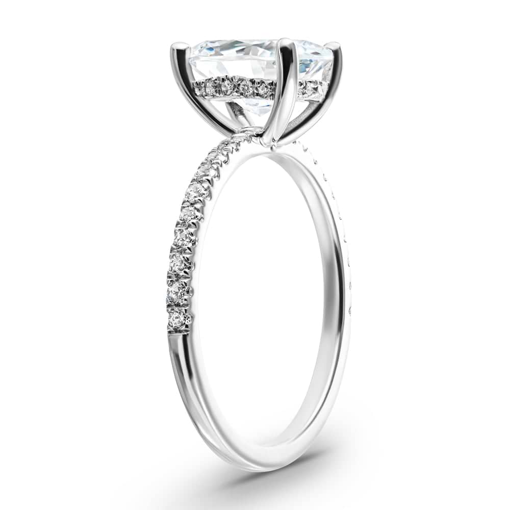 Shown with 1.5ct Oval Cut Lab Grown Diamond in 14k White Gold|diamond accented hidden halo engagement ring with 1.5ct oval cut lab grown diamond in 14k white gold shown from side