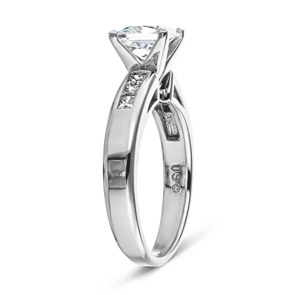 Shown with 1ct Princess Cut Lab Grown Diamond in 14k White Gold|Cathedral style engagement ring with 1ct princess cut lab diamond in channel set diamond accented 14k white gold band shown from side