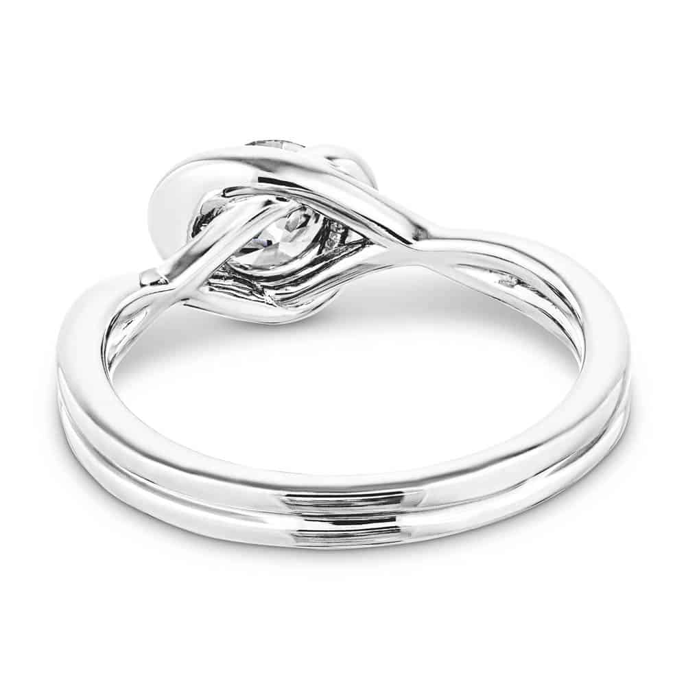 Shown with 1ct Round Cut Lab Grown Diamond in Platinum|Modern engagement ring with twisted band design holding a 1ct round cut lab grown diamond in platinum setting shown from back