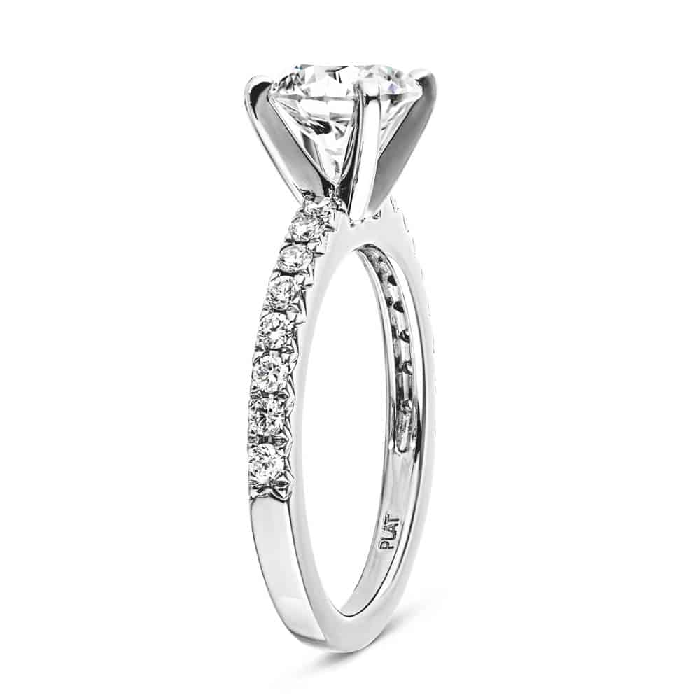 Shown with 1ct Round Cut Lab Grown Diamond in Platinum|Diamond accented engagement ring with 1ct round cut lab grown diamond in platinum setting shown from side