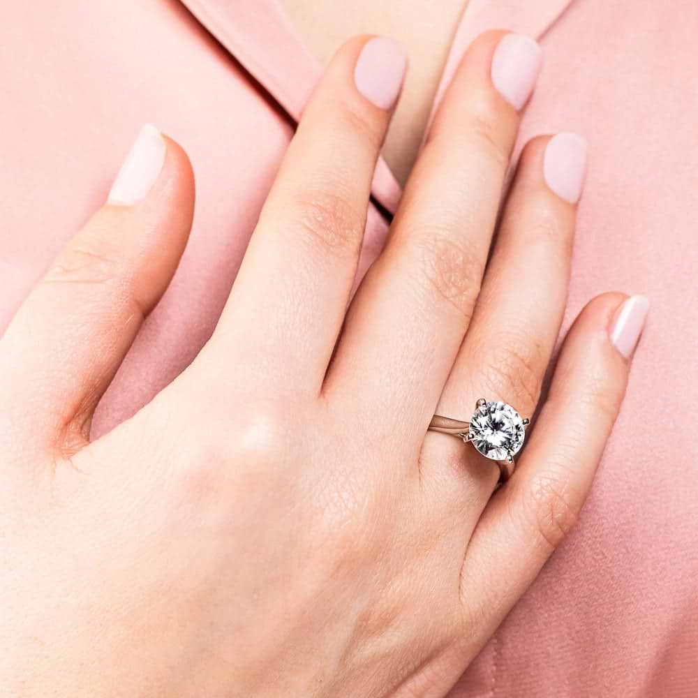 Shown In 14K White Gold With A Round Cut Center Stone|solitaire cathedral style ring set with a round cut lab grown diamond center stone
