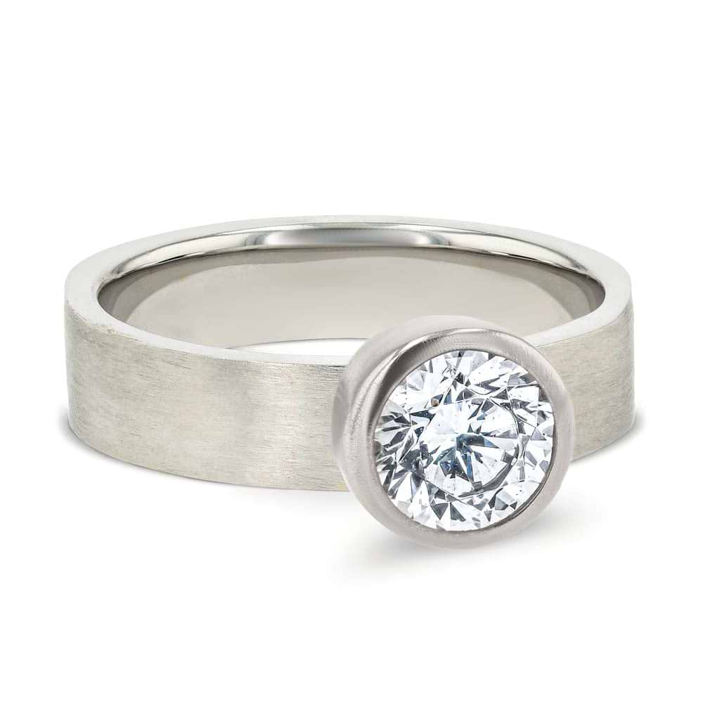 Shown in 14K White Gold with a Satin Finish|bezel set solitaire engagement ring with satin finish in 14k white gold metal