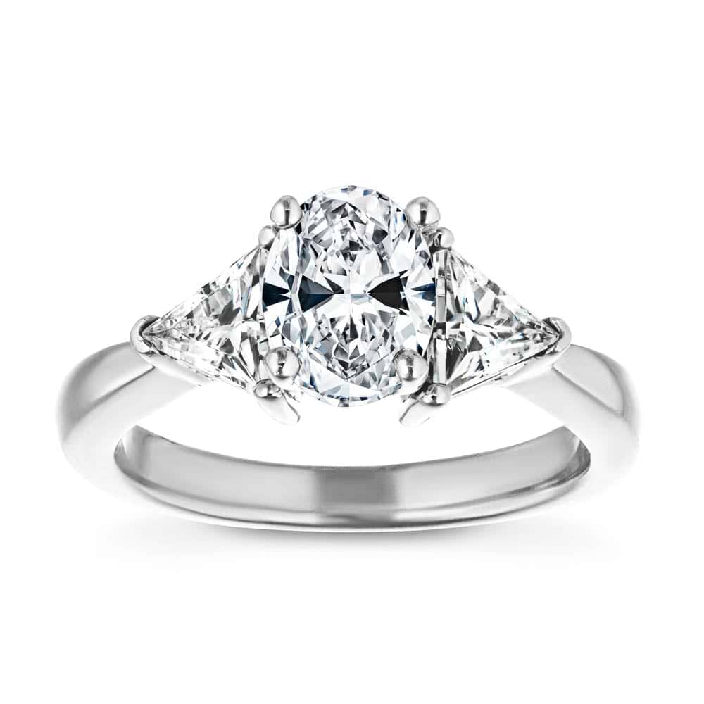 Shown with 1ct Oval Cut Lab Grown Diamond & 0.50ct Triangle Cut Side Stones in 14k White Gold|Beautiful conflict free three stone engagement ring with 1ct oval cut lab grown diamond and two 0.50 triangle cut diamond side stones in 14k white gold band