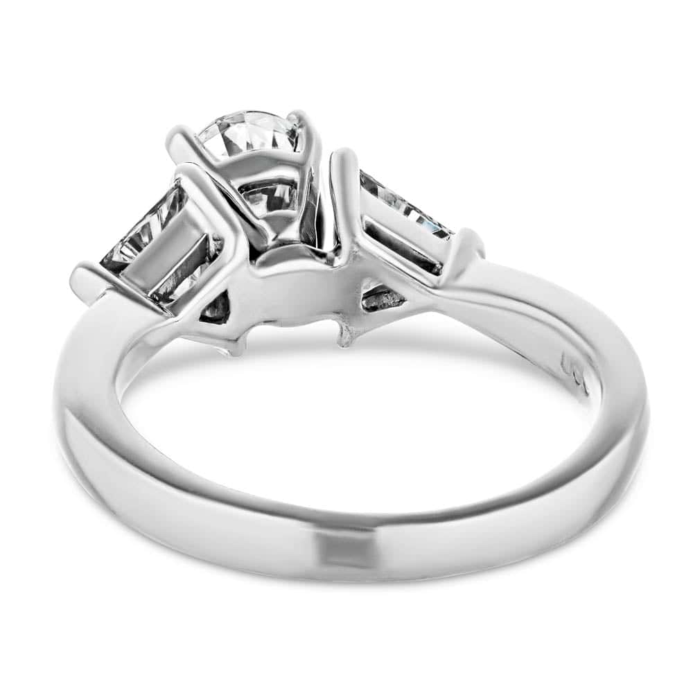 Shown with 1ct Oval Cut Lab Grown Diamond & 0.50ct Triangle Cut Side Stones in 14k White Gold|Three stone engagement ring with 1ct oval cut lab grown diamond and two 0.50 triangle cut diamond side stones in 14k white gold band shown from back