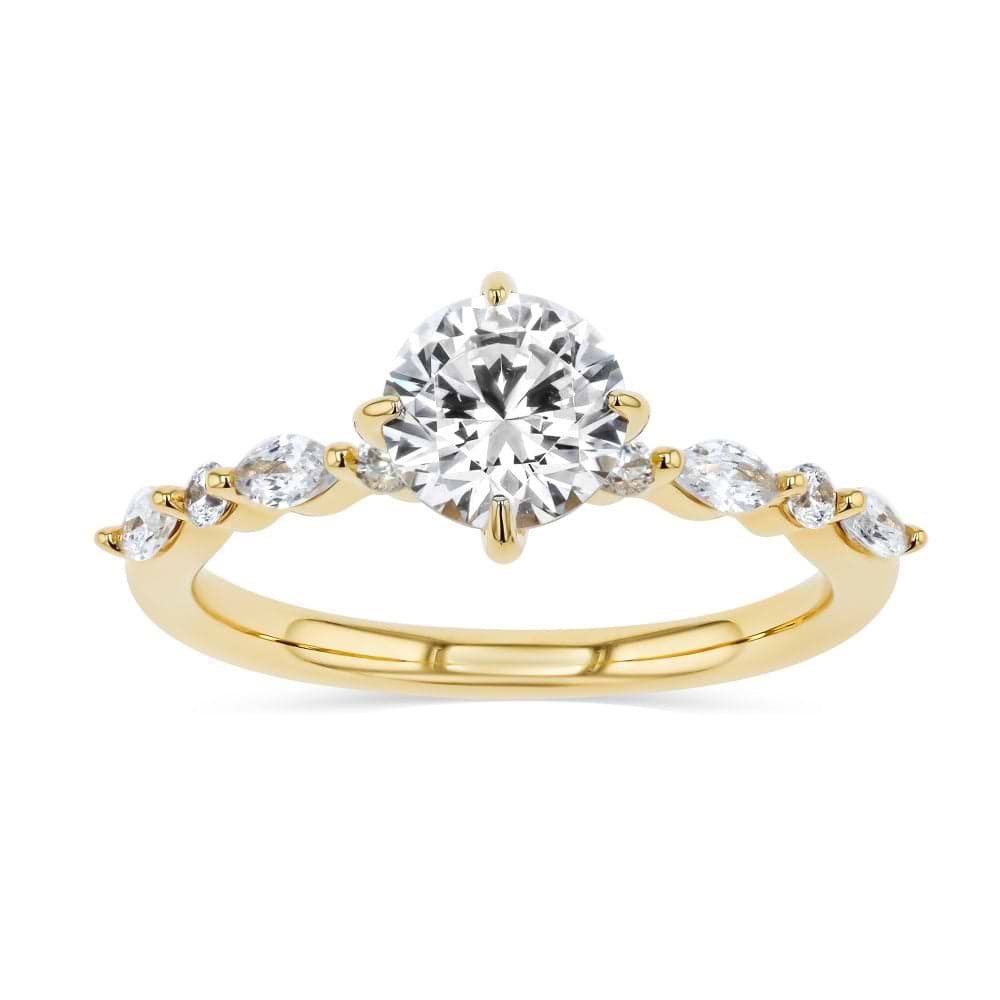 Shown here with a 1.0ct Round Cut center stone in 14K Yellow Gold|summer engagement ring with diamond accenting stones and a round cut center stone set in 14k yellow gold metal