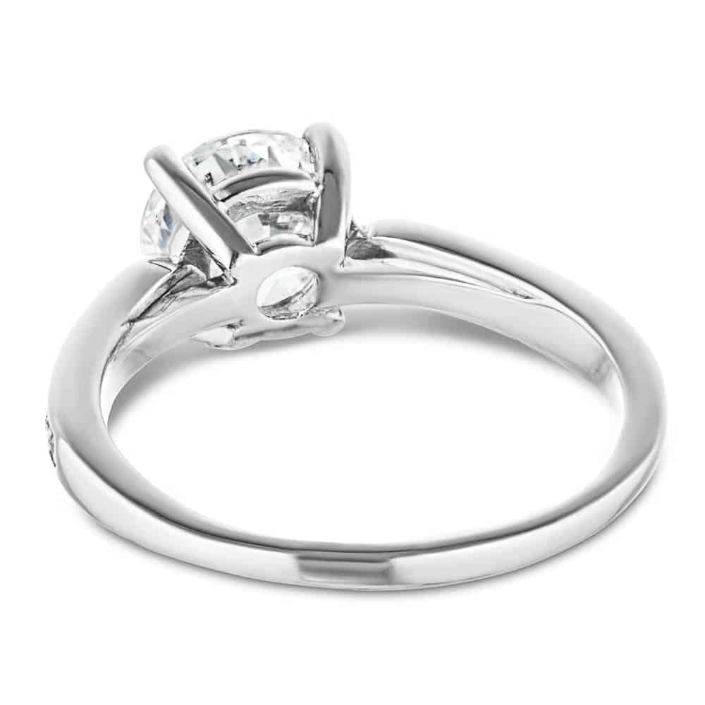 Shown with a 1.0ct Round cut Lab-Grown Diamond with accenting diamonds on the band in recycled 14K white gold 