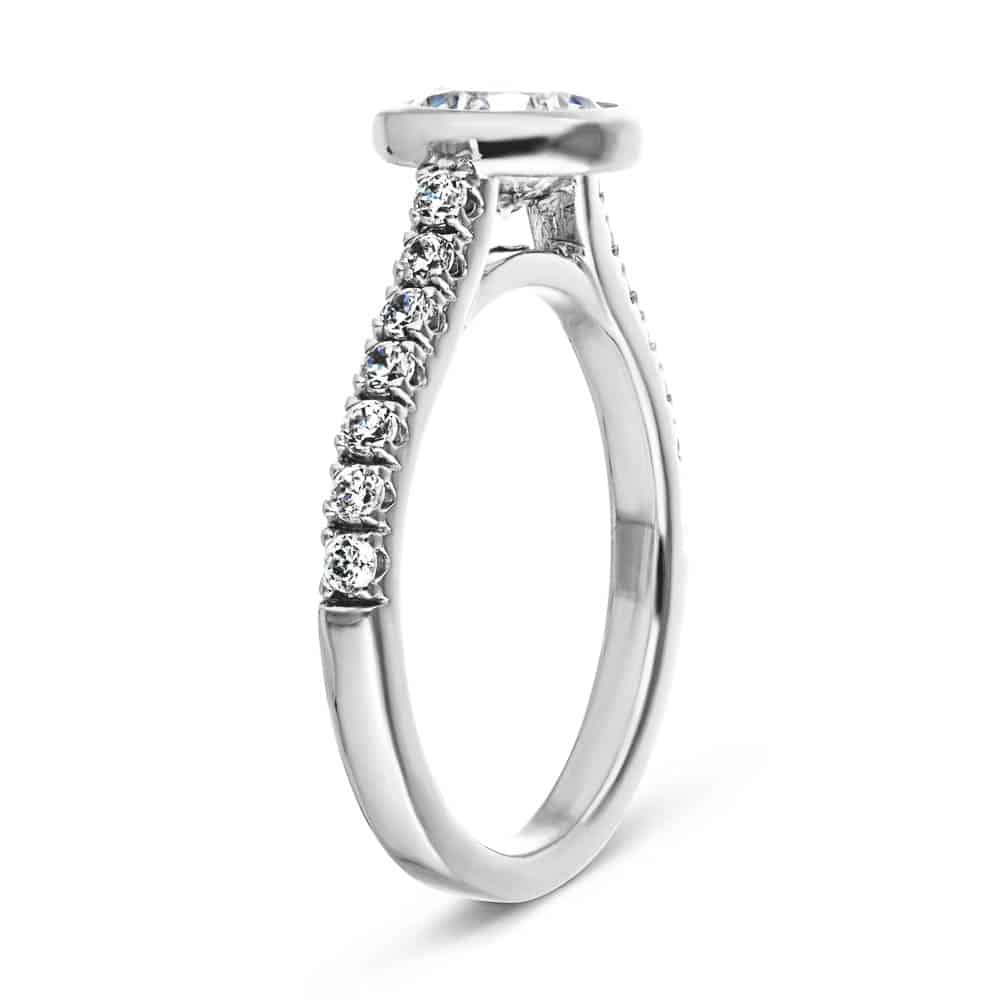 Shown with a bezel set 1.0ct Round cut Lab-Grown Diamond with accenting stones on the band in recycled 14K white gold | stackable engagement ring Shown with a bezel set 1.0ct Round cut Lab-Grown Diamond with accenting stones on the band in recycled 14K white gold