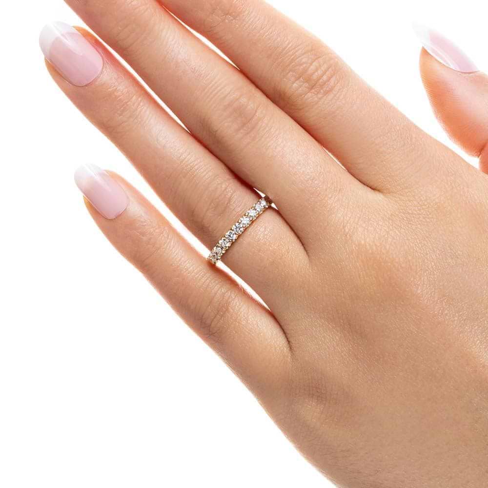 Shown with 0.50ctw Lab Diamonds in 14k Yellow Gold|Ethical diamond accented wedding band with 11 round cut lab grown diamonds set in 14k yellow gold shown worn on hand
