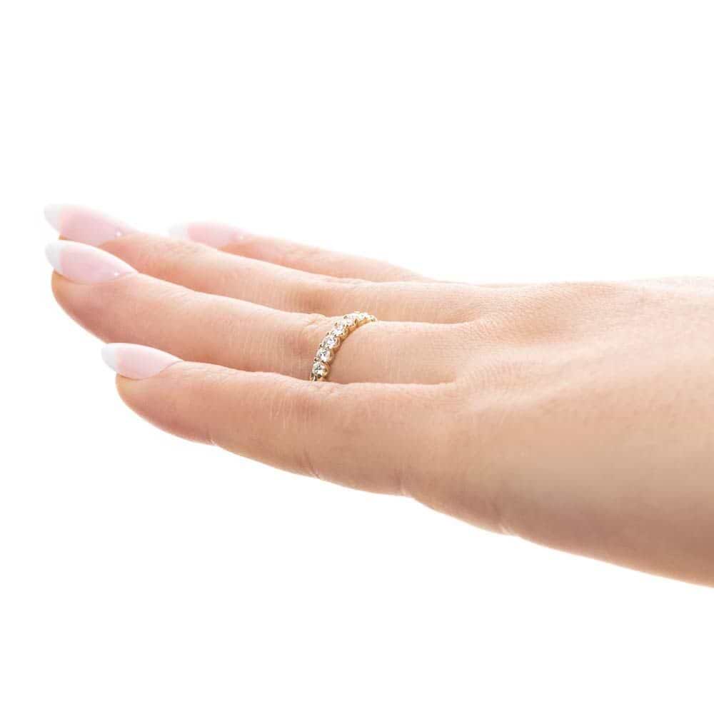 Shown with 0.50ctw Lab Diamonds in 14k Yellow Gold|Diamond accented wedding band with 11 round cut lab grown diamonds set in 14k yellow gold shown worn on hand sideview