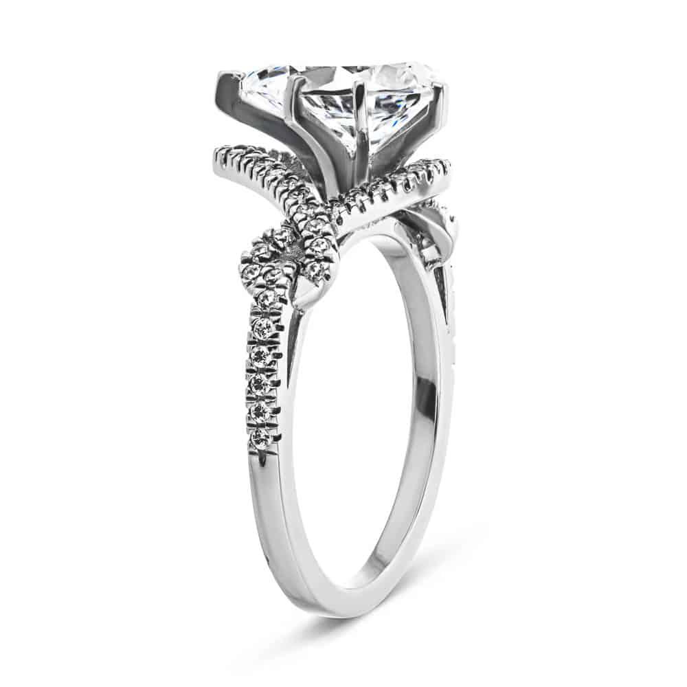 Shown with a 1.0ct Pear cut Lab-Grown Diamond with a diamond accented halo and twisted detail band in recycled 14K white gold with matching wedding band, can be purchased together for a discounted price 