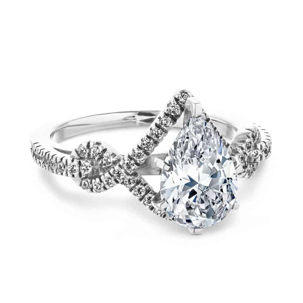 Shown with a 1.0ct Pear cut Lab-Grown Diamond with a diamond accented halo and twisted detail band in recycled 14K white 