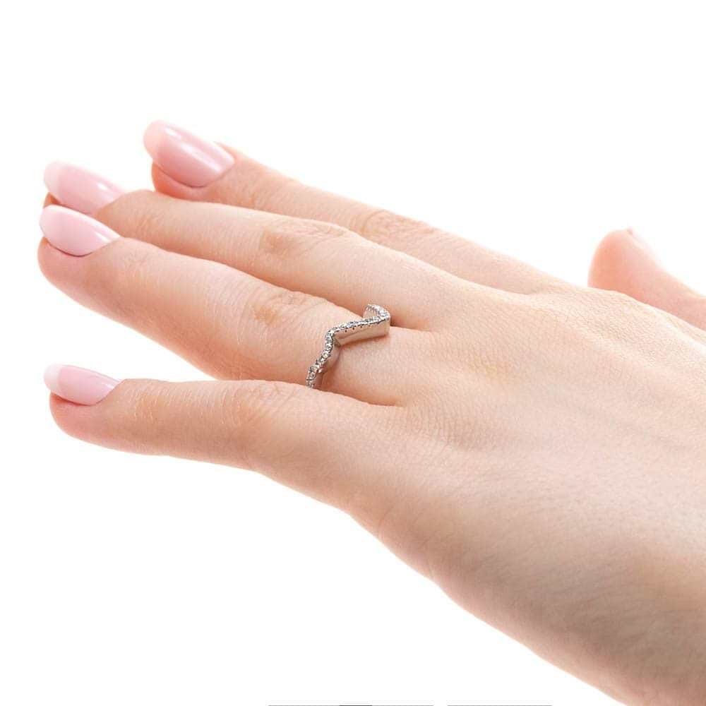 Shown in 14k White Gold|Unique diamond accented wavy v wedding band in 14k white gold shown worn on hand from side
