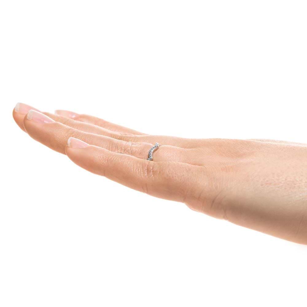 Shown in 14k White Gold|Unique wavy diamond accented wedding band in 14k white gold worn on hand sideview