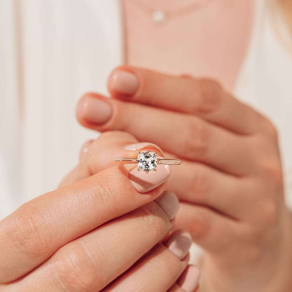 Shown with a 1ct Cushion cut Lab Grown Diamond in 14k Rose Gold|Hidden halo engagement ring with 8 prongs holding a 1ct cushion cut lab grown diamond in 14k rose gold