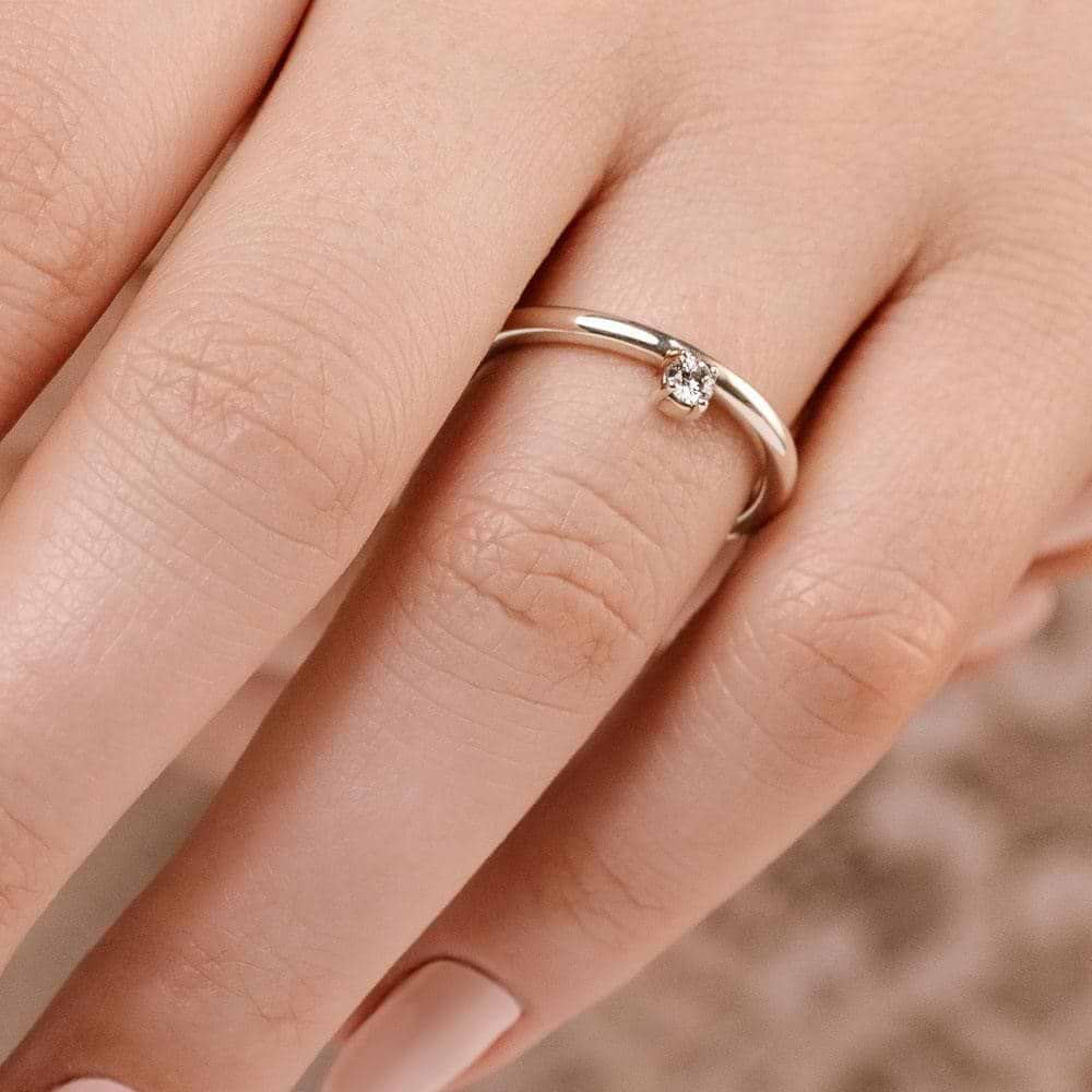 Shown with 0.10ct Lab Grown Diamond in 14k White Gold|Unique asymmetrical stackable ring with 0.10ct round cut lab grown diamond in 14k white gold shown worn on hand