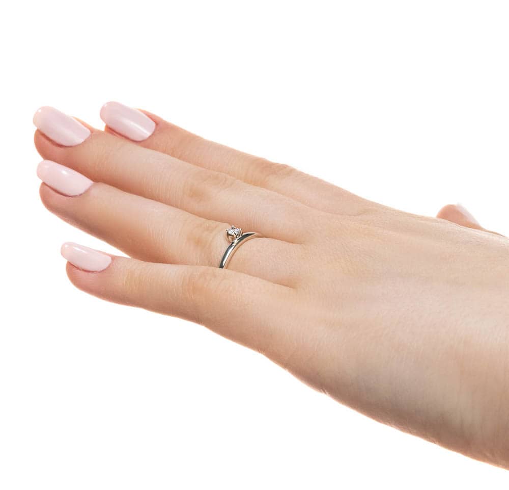 Shown with 0.10ct Lab Grown Diamond in 14k White Gold|Unique asymmetrical stackable ring with 0.10ct round cut lab grown diamond in 14k white gold shown worn on hand sideview
