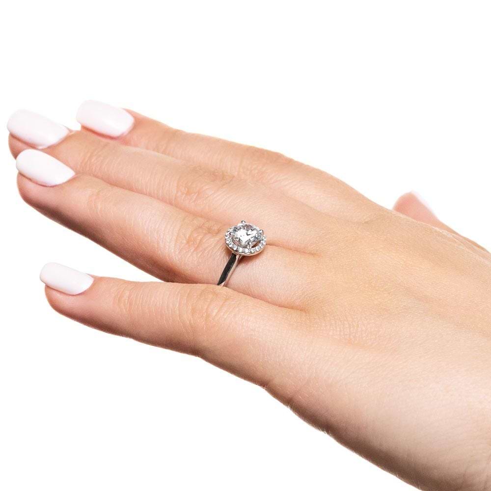 Shown with 1ct Round Cut Lab Grown Diamond in 14k White Gold|Stackable diamond halo engagement ring with a 1ct round cut lab grown diamond in 14k white gold worn on hand sideview