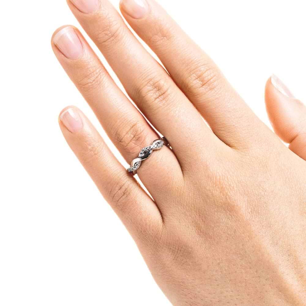 Shown in 14k White Gold|Unique beautiful braided metal design diamond accented wedding ring in 14k white gold shown worn on hand