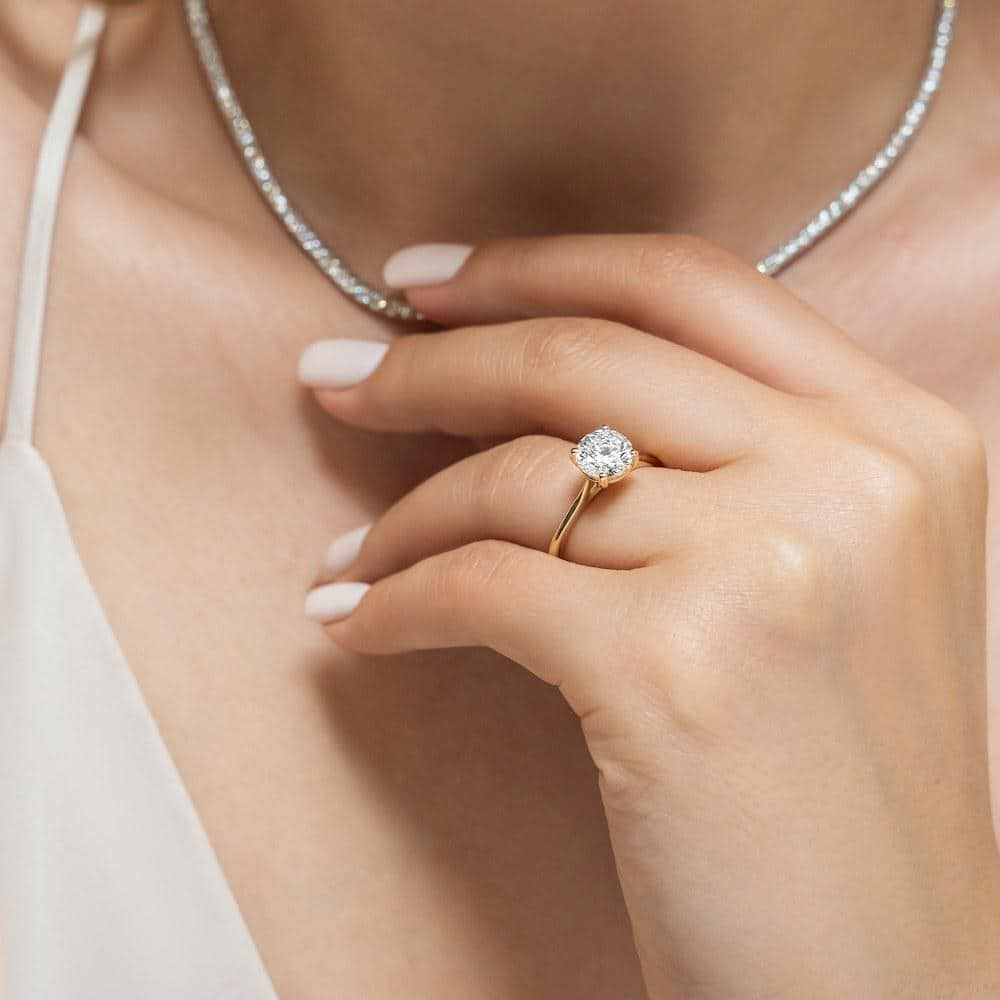 Shown with a 1.0ct Round cut Lab-Grown Diamond in recycled 14K yellow gold | solitaire engagement ring 1.0ct round cut Lab-Grown Diamond in recycled 14K yellow gold