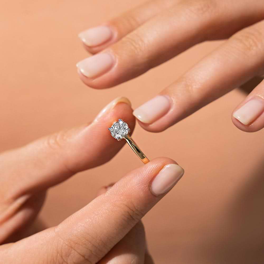 Shown with a 1.0ct Round cut Lab-Grown Diamond in recycled 14K yellow gold | solitaire engagement ring 1.0ct round cut Lab-Grown Diamond in recycled 14K yellow gold