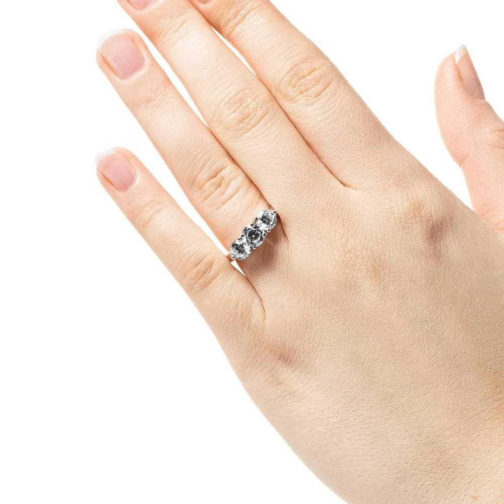 Shown with three Round Cut Lab Grown Diamonds in 14k White Gold|Three stone engagement with round cut lab grown diamonds in 14k white gold worn on hand