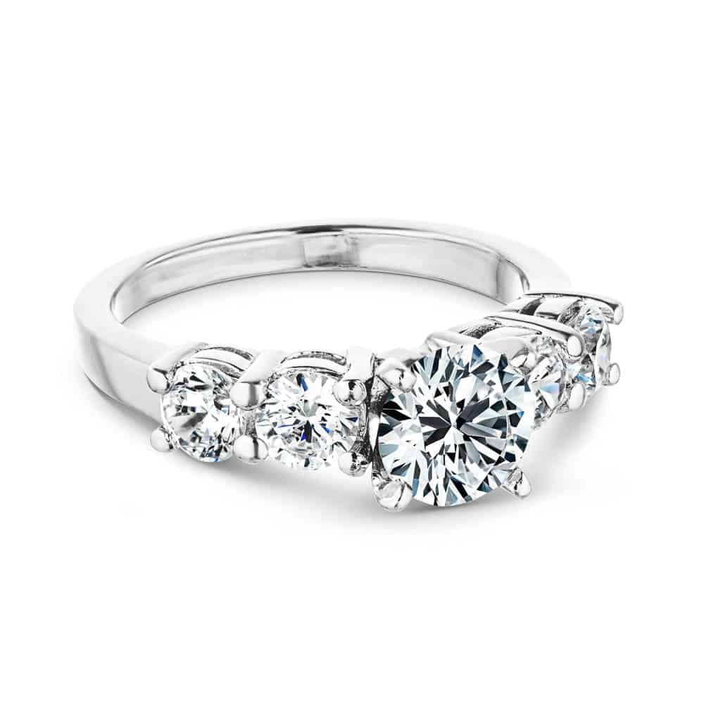 Shown with a 1ct Round Cut Lab Grown Diamond Center Stone amid four 0.25ct Diamond Hybrids in 14k White Gold|Accented engagement ring with a 1ct round cut lab grown diamond amid diamond hybrid simulants totaling 1ctw in 14k white gold