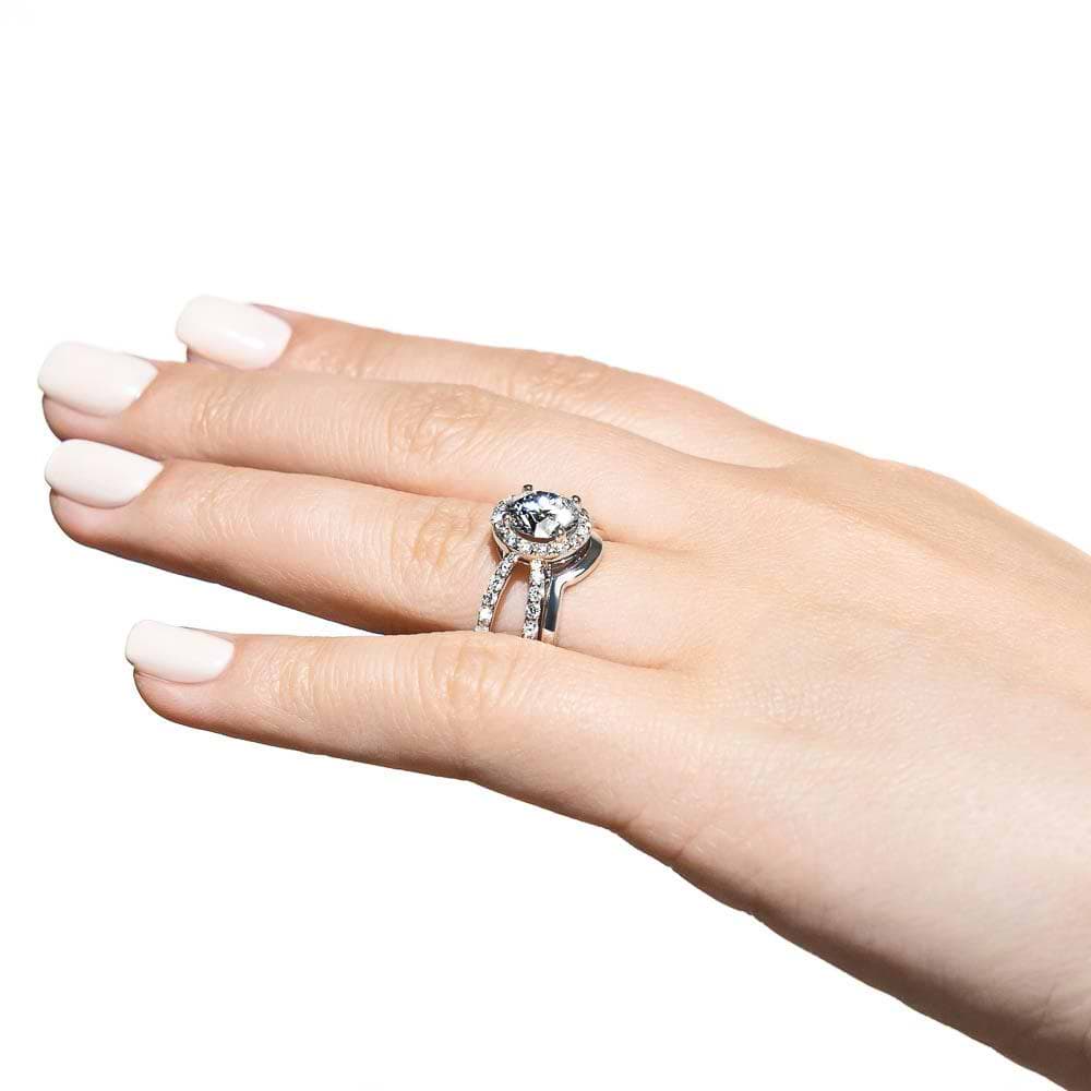 Shown with a 1.0ct Round cut Lab-Grown Diamond with diamond accented halo and split shank in recycled 14K white gold with matching wedding band| diamond accented engagement ring Shown with a 1.0ct Round cut Lab-Grown Diamond with diamond accented halo and split shank in recycled 14K white gold with matching wedding band