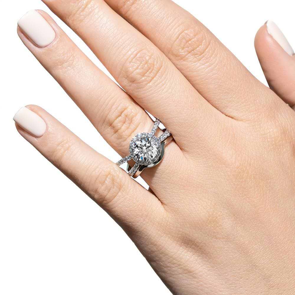 Shown with a 1.0ct Round cut Lab-Grown Diamond with diamond accented halo and split shank in recycled 14K white gold with matching wedding band| diamond accented engagement ring Shown with a 1.0ct Round cut Lab-Grown Diamond with diamond accented halo and split shank in recycled 14K white gold with matching wedding band