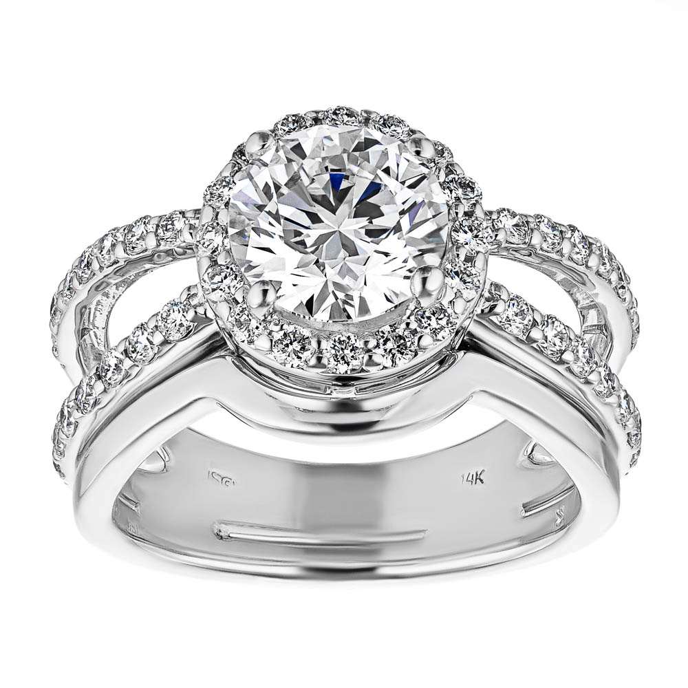 Shown with a 1.0ct Round cut Lab-Grown Diamond with diamond accented halo and split shank in recycled 14K white gold with matching wedding band