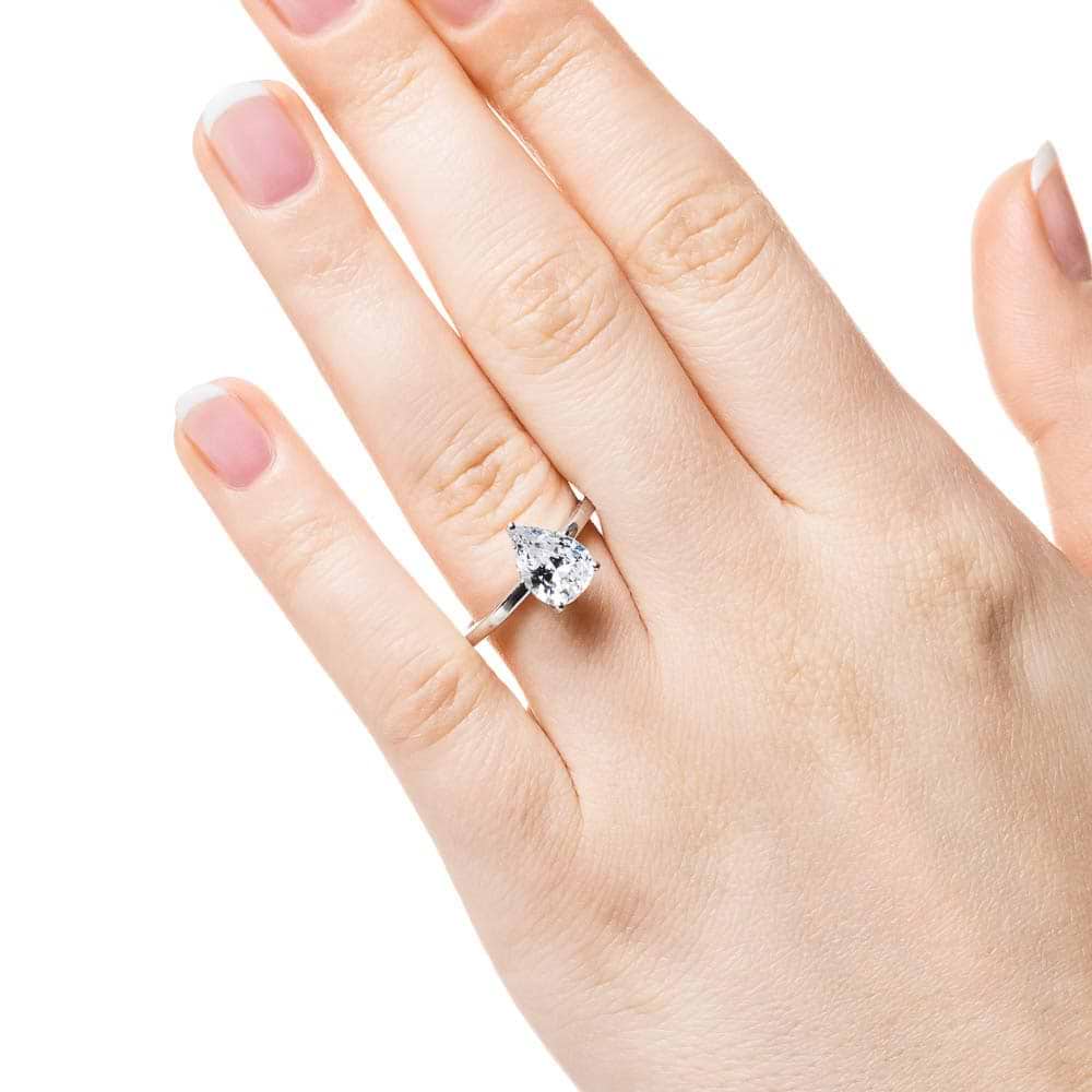 Shown with 1ct Pear Cut Lab Grown Diamond in 14k White Gold