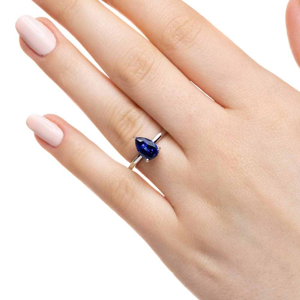 Shown with 1ct Pear Cut Lab Grown Blue Sapphire in 14k White Gold