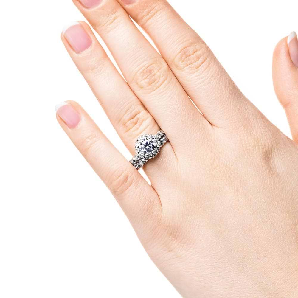 Shown with a 1.0ct Round cut Lab-Grown Diamond with diamond entwined halo and band in recycled 14K white gold with matching wedding band| engagement ring diamond accented halo and band 1.0ct round cut lab-grown diamond in recycled 14k white gold with matching band