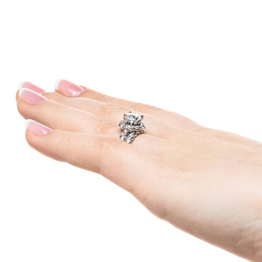 Shown with a 1.0ct Round cut Lab-Grown Diamond with diamond entwined halo and band in recycled 14K white gold with matching wedding band| engagement ring diamond accented halo and band 1.0ct round cut lab-grown diamond in recycled 14k white gold with matching band