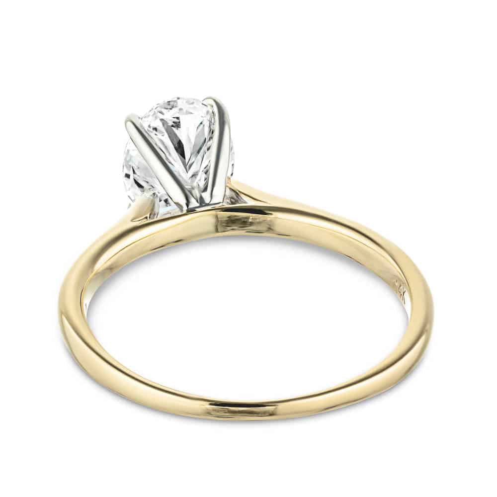 Set with a 2.5ct oval cut lab grown diamond in 14k yellow gold