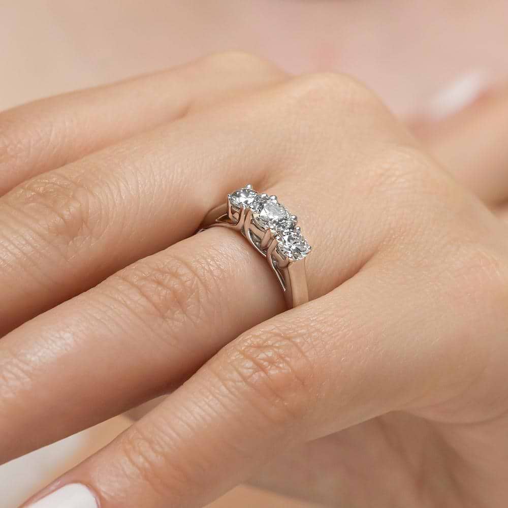 Shown with Three Round Cut Lab Grown Diamonds in 14k White Gold|Beautiful three stone engagement ring with round cut lab grown diamonds in 14k white gold shown worn on hand