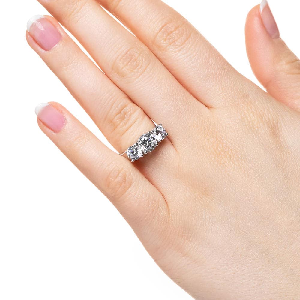 Shown with Three Round Cut Lab Grown Diamonds in 14k White Gold|Three stone engagement ring with round cut lab grown diamonds in 14k white gold worn on hand