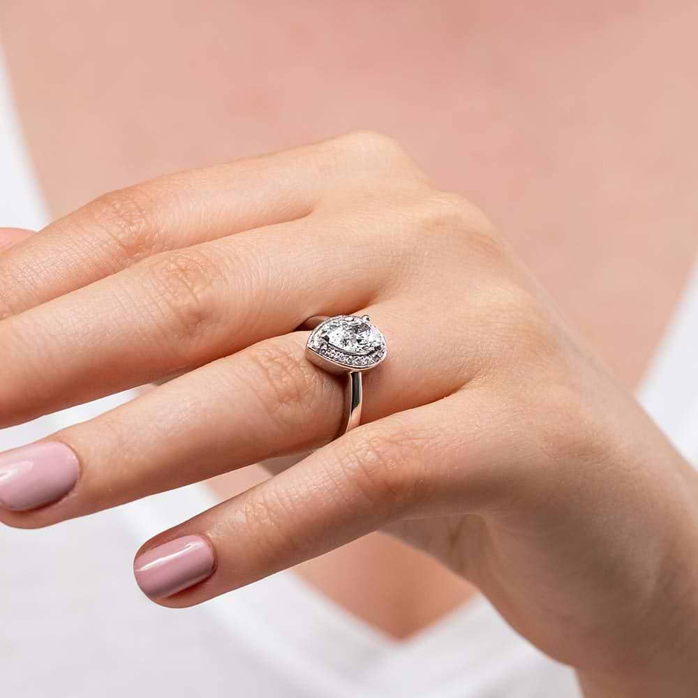 Shown with 1ct Pear Cut Lab Grown Diamond in 14k White Gold|Diamond halo engagement ring with 1ct pear cut lab grown diamond set in 14k white gold