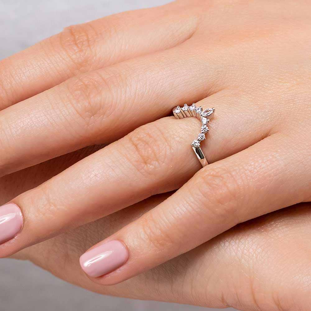 Shown here with accented diamonds in recycled 14K white gold. | Accented diamond v shape wedding band.