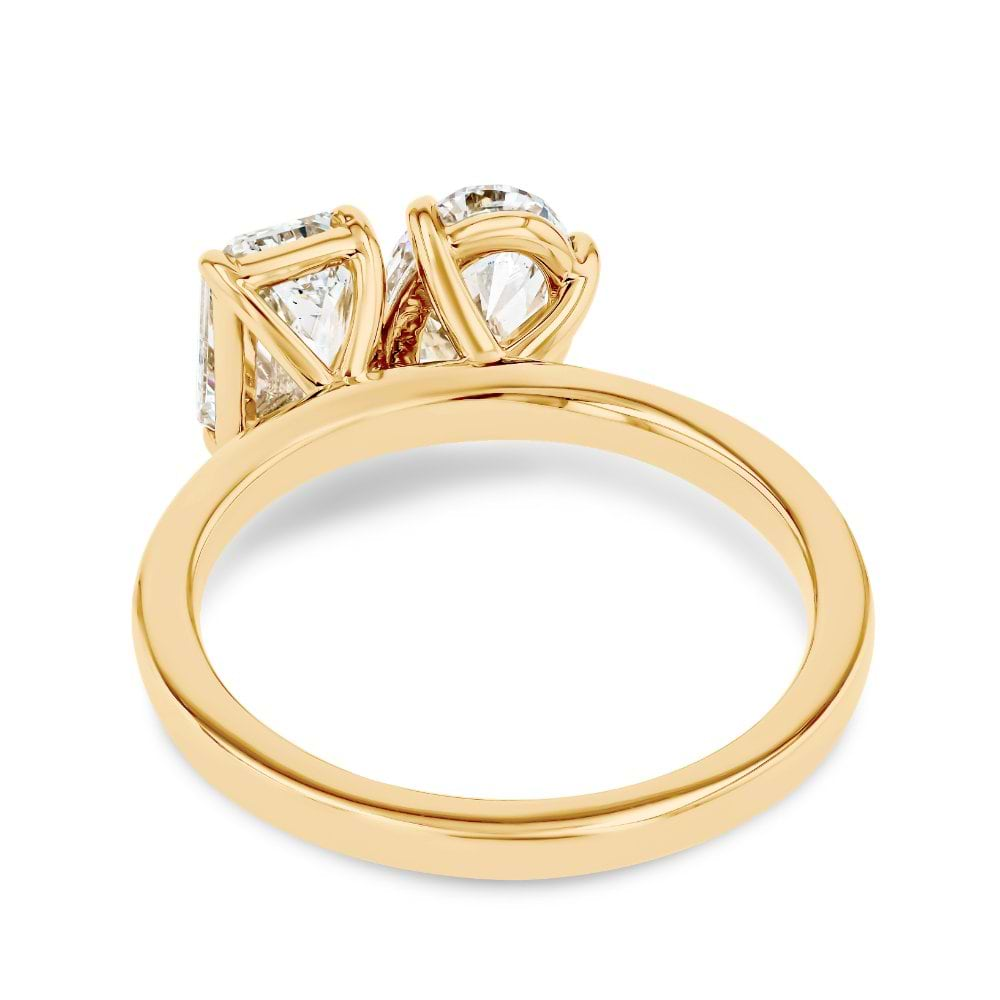 Shown In 14K Yellow Gold With An Emerald Cut and Oval Cut Lab Grown Diamond