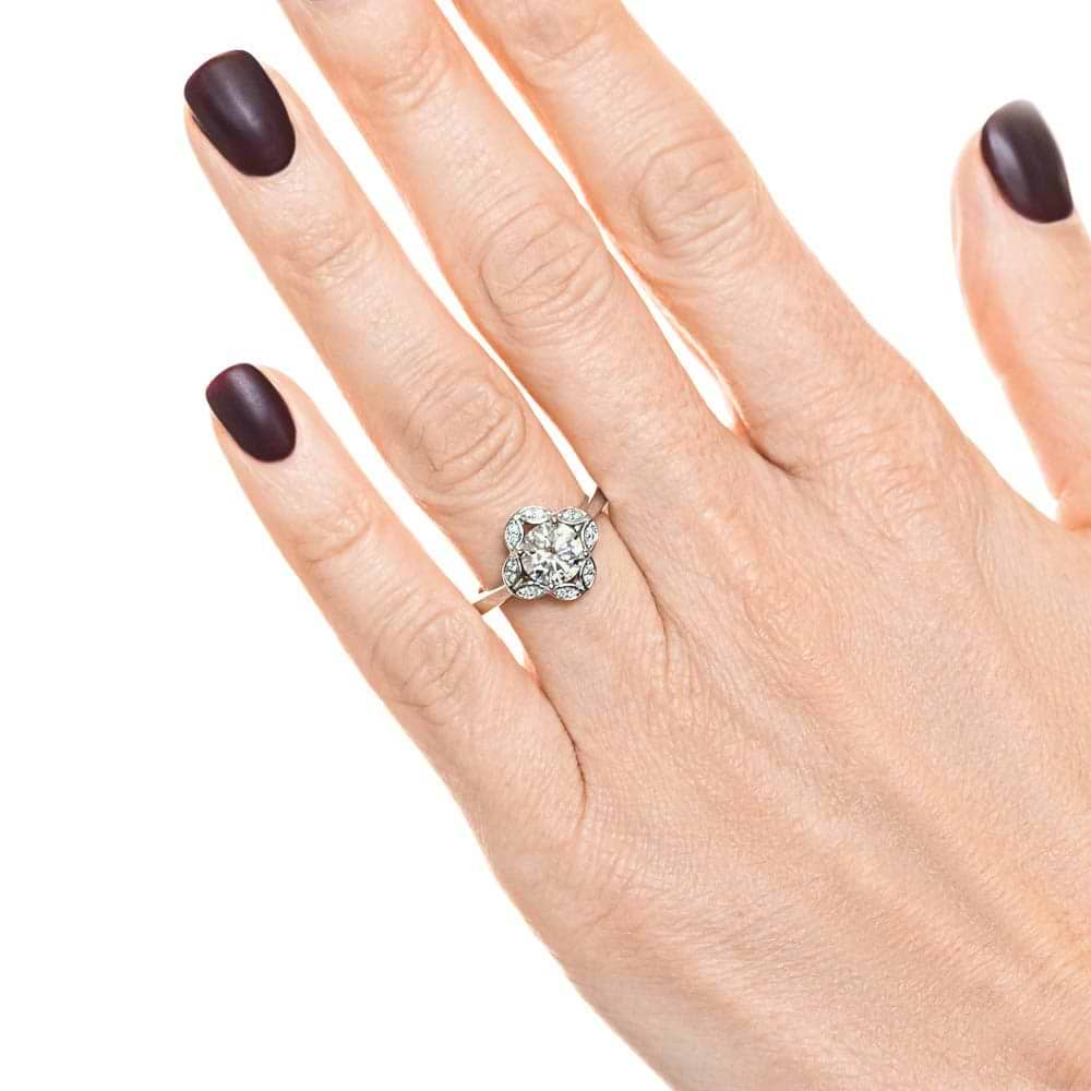 Shown with 1ct round cut lab grown diamond in 14k white gold|Nature inspired vintage style engagement ring with floral petal halo design around a 1ct round cut lab diamond in 14k white gold