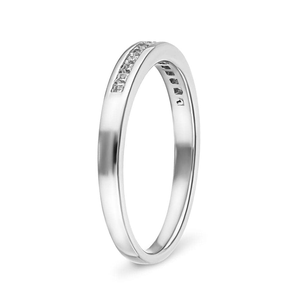 Channel set diamond accented wedding band 