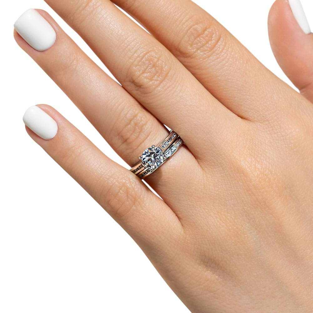 Shown with a 1.0ct Round cut Lab Grown Diamond with channel set diamond accented band with matching wedding band in recycled 14K white gold | wedding set Shown with a 1.0ct Round cut Lab Grown Diamond with channel set diamond accented band with matching wedding band in recycled 14K white gold