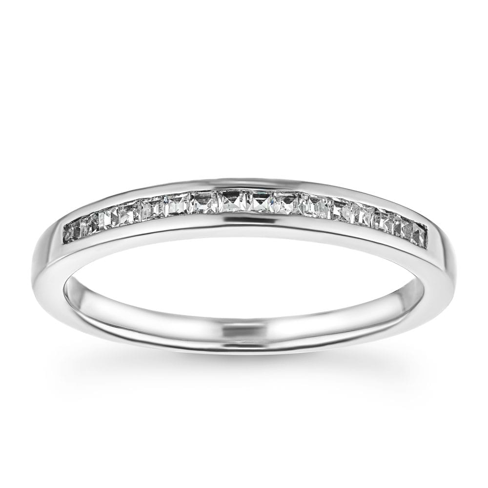 Channel set diamond accented wedding band 