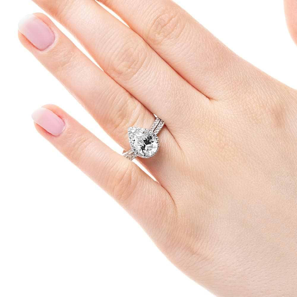 Shown with a 1.91ct Pear cut Lab-Grown Diamond in recycled 14K white gold with matching wedding band