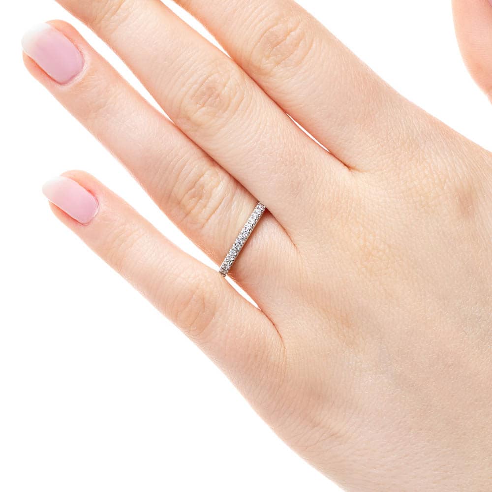 Diamond accented wedding band in recycled 14K white gold 