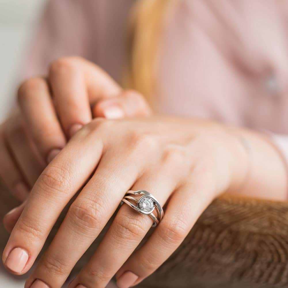 Shown with a 1.25ct Round cut lab-grown diamond in recycled 14K white gold with matching wedding band | two-tone wedding set shown with a 1.25ct Round cut Lab-Grown Diamond in recycled 14K white gold with matching wedding band