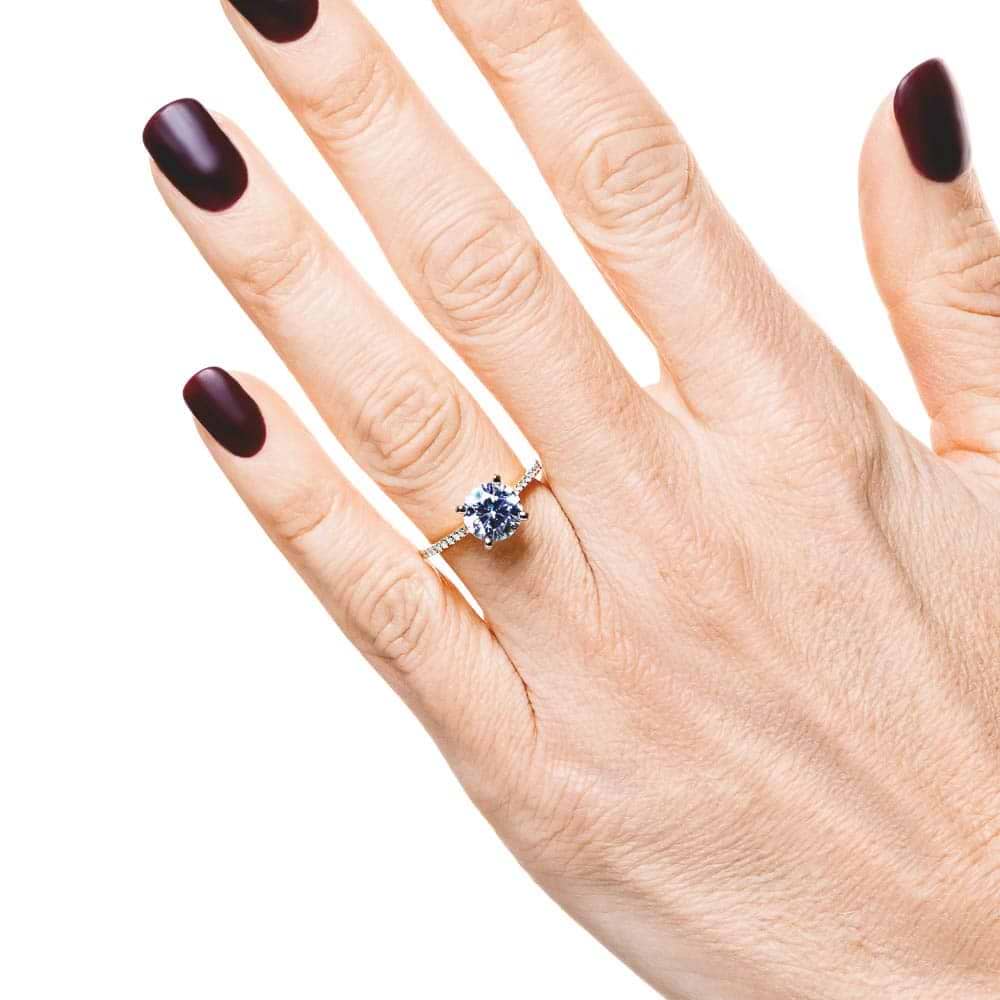 Shown with 1.5ct Round Cut Lab Grown Diamond in 14k Yellow Gold|Diamond accented engagement ring with 1.5ct round cut lab grown diamond set in 6 prong 14k yellow gold setting worn on hand