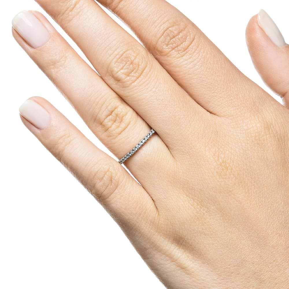 Diamond accented wedding band in recycled 14K white gold 