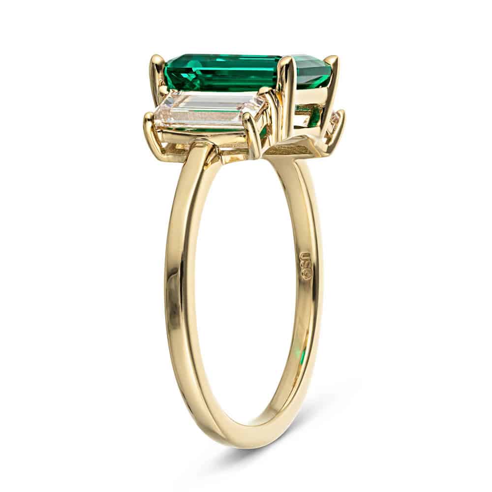 Shown with 2ct Emerald Cut Lab Grown Emerald with 2 Baguette Cut Lab Diamonds in 14k Yellow Gold