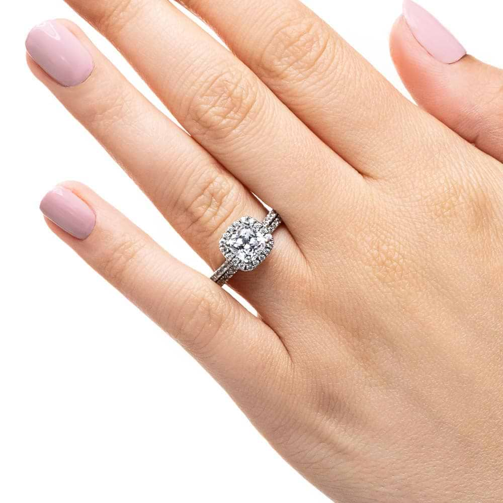 Shown with a 1.0ct Cushion cut Lab-Grown Diamond with a diamond accented halo and diamonds accenting the band in recycled 14K white gold with matching band, purchase the set for a discount 